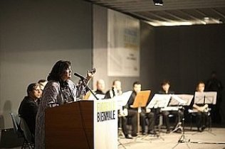 Carol Worthey addresses distinguished audience